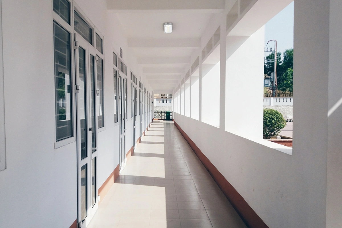 recessed emergency exit sign installation in school corridor